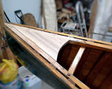 Chesnut canoe with a new deck and spliced inwales.