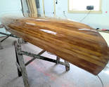 New fibreglass covering on a cedarstrip canoe.